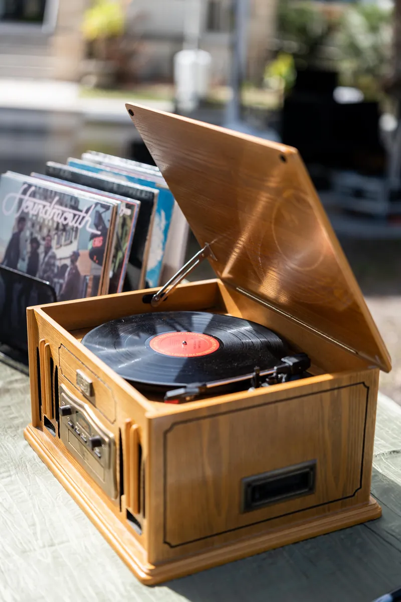 Vintage wooden record player with vinyl spinning at the cocktail hour