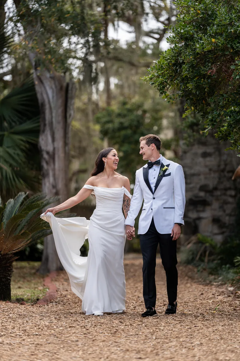 Couple laughing while walking hand in hand through Fountain of Youth gardens