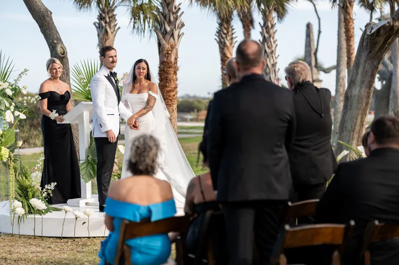 Father of the bride escorting Michelle to Bryant at the ceremony altar