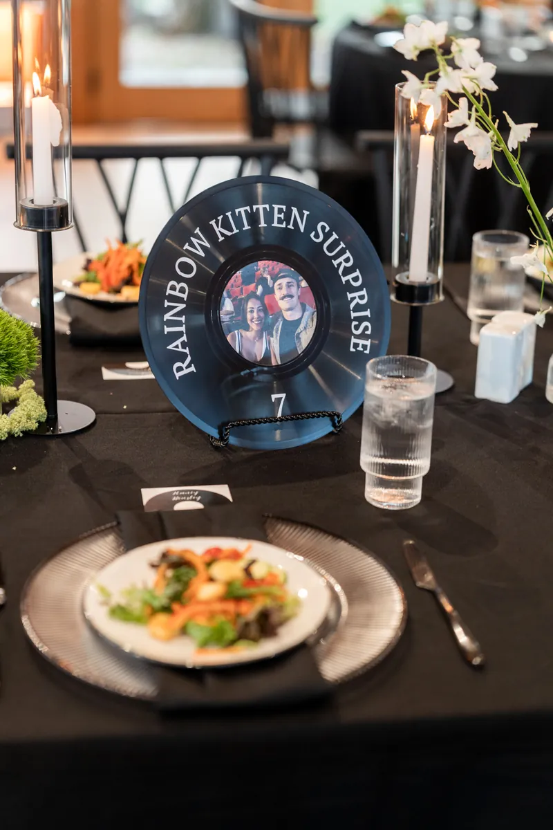 Vinyl record table number for Rainbow Kitten Surprise with couple photo in center