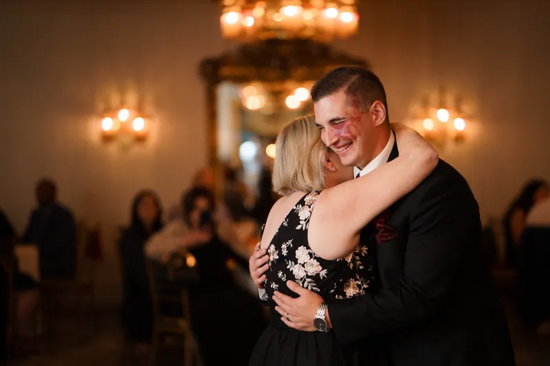 Michael and his dance partner sway together amid glowing wall sconces and ornate décor at Casa Monica Resort & Spa.