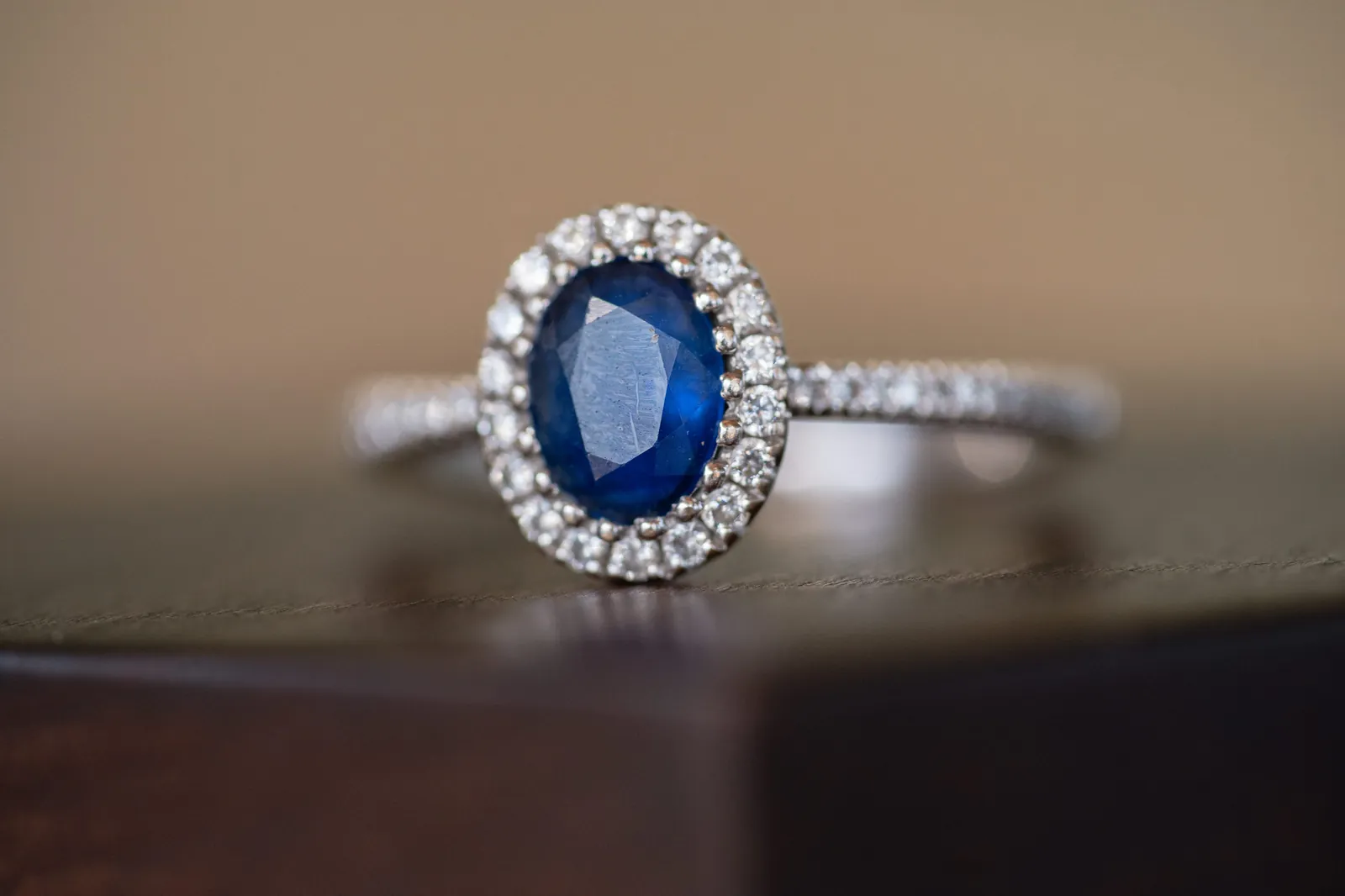 Wedding rings nestled in baby's breath inside wooden ring box