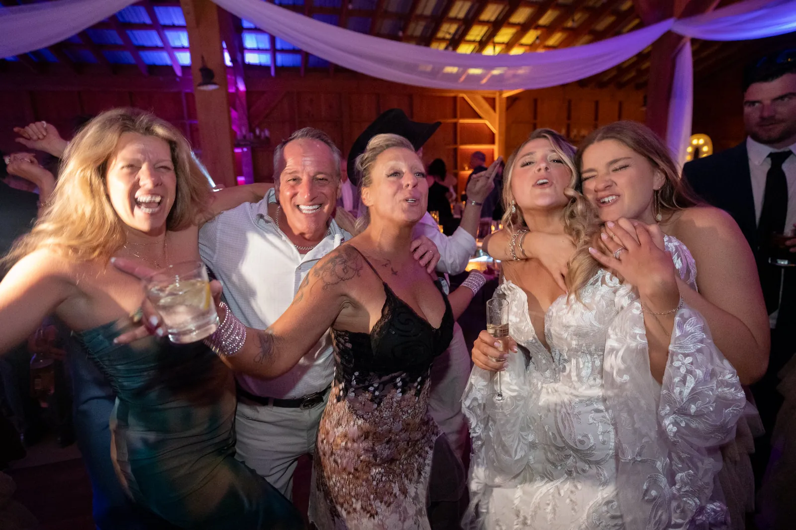 Bride Riley dancing with family at reception party at Tringali Barn