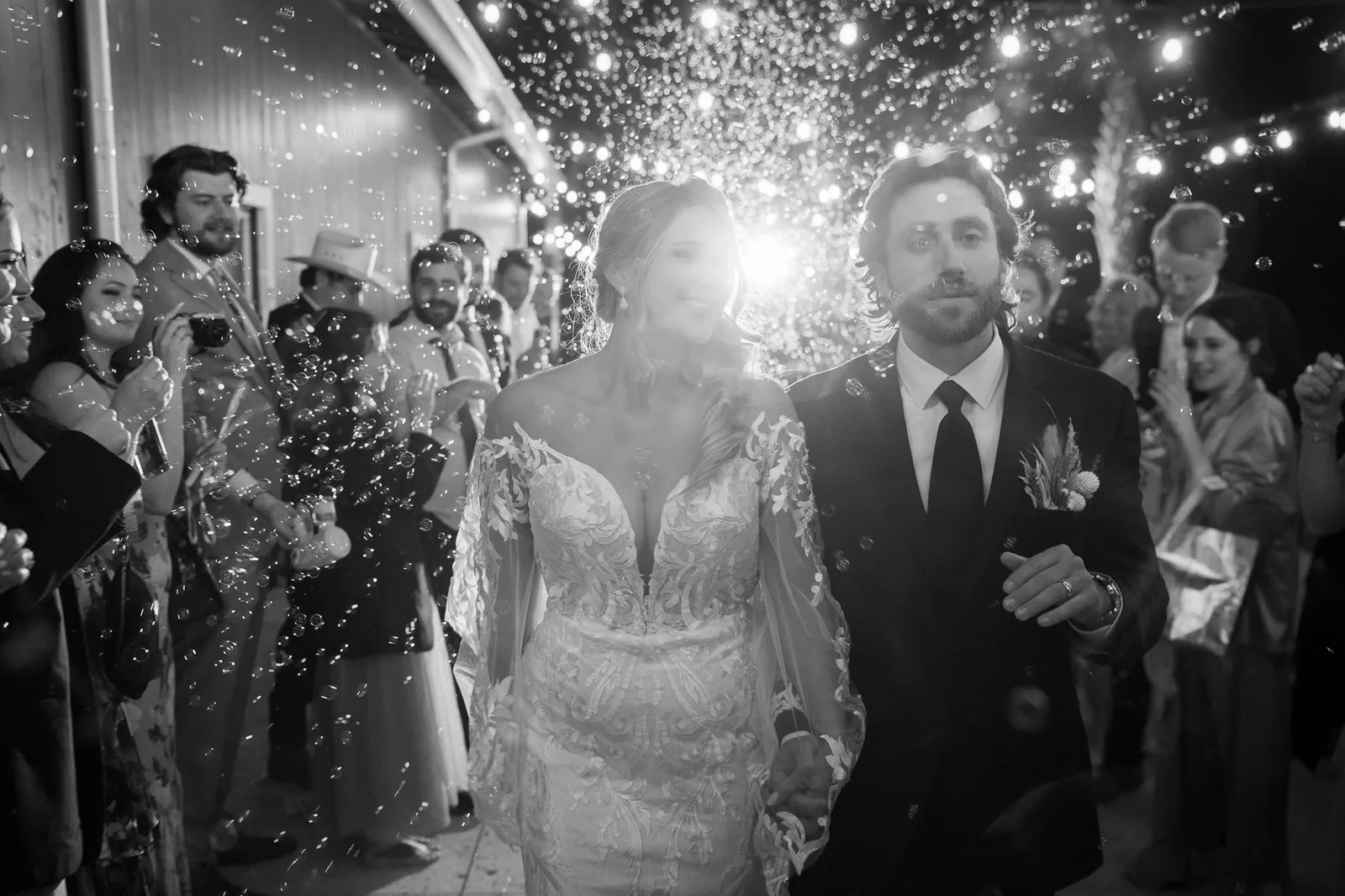 Riley and Robert bubble exit in black and white at Tringali Barn wedding