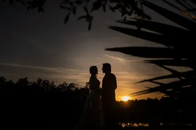 Couple sunset silhouette portrait at Tringali Barn