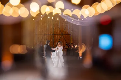 First dance inside barn with fairy lights at Tringali Barn