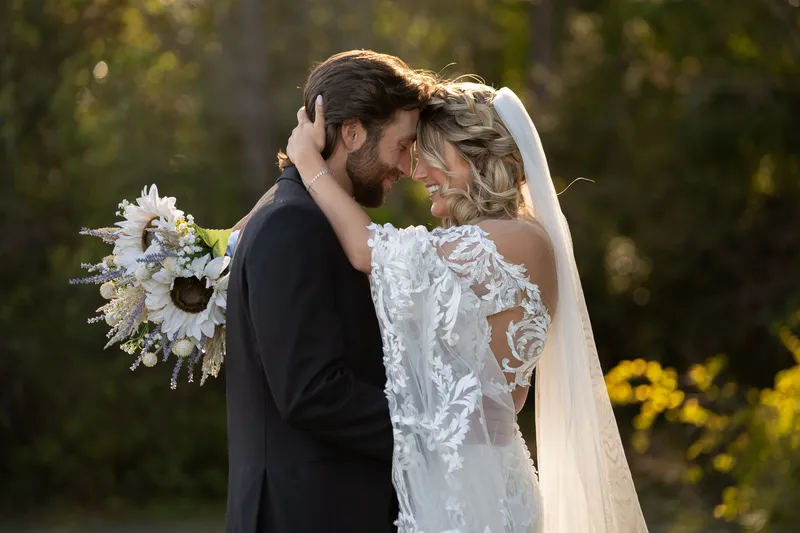 Couple intimate portrait at golden hour at Tringali Barn