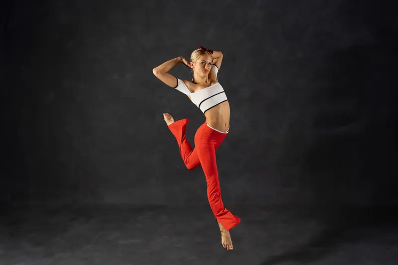 Sadie mid-jump during dance portrait session at WSOTA studio