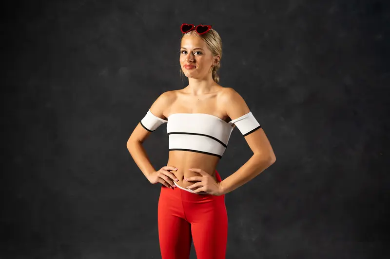 Hands on hips portrait with confident smile and heart sunglasses