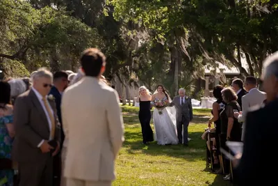 Bride walking down the aisle at Fountain of Youth outdoor ceremony