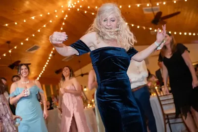 Wedding reception dancing under string lights in The Magnolia Room