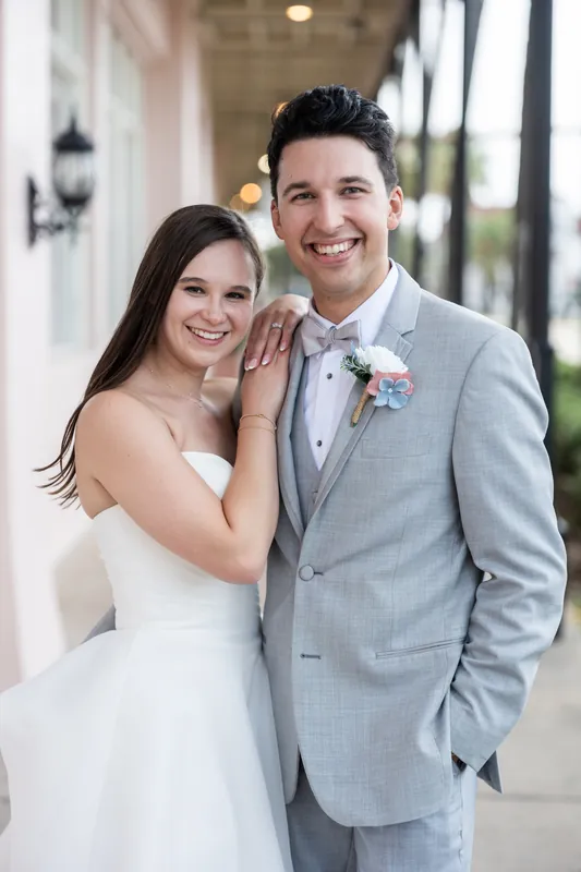 Sarah's train trails behind her as she and Nathan walk down the aisle together following their first kiss as newlyweds.