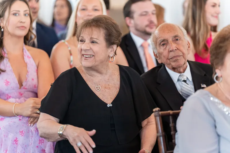 Wedding guests smile and chat during the ceremony at Villa Blanca, St. Augustine.