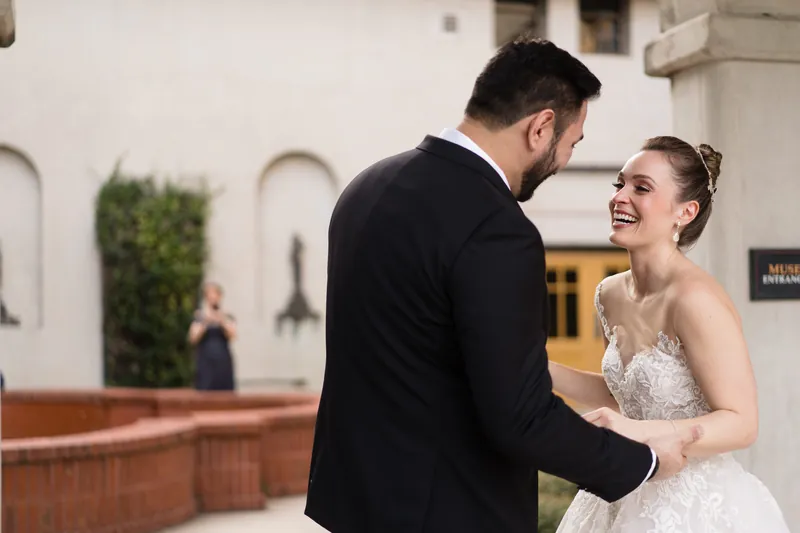 Michael and Simone laugh together with their foreheads nearly touching at Casa Monica Resort & Spa.