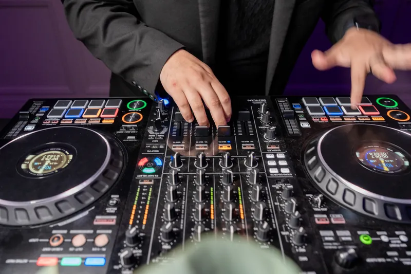 A DJ operates turntables with both hands at The Treasury on the Plaza, St. Augustine during the reception.