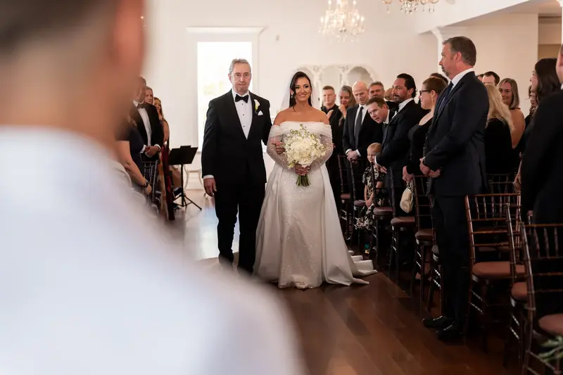 Tayler walking down the aisle with her father