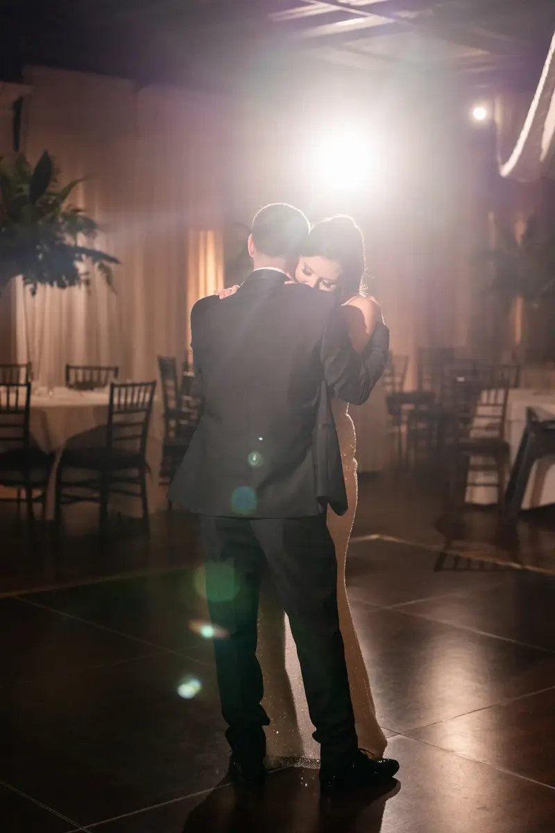 Last dance silhouette with spotlight in empty reception hall