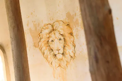 Lion mural painting on castle wall detail at Castle Ottis wedding venue in St. Augustine
