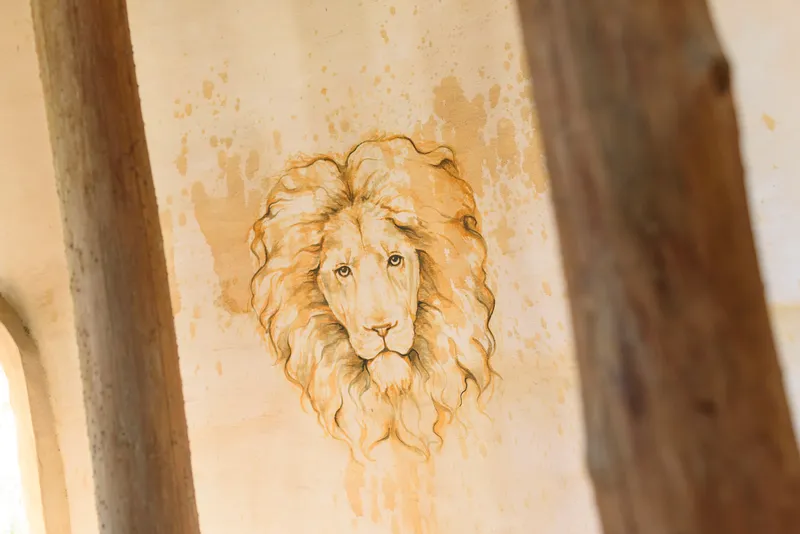 Lion mural painting on castle wall detail at Castle Ottis wedding venue in St. Augustine
