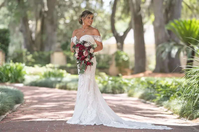 Bride and groom portrait on the grand staircase at Epping Forest Yacht Club