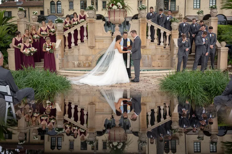 Wedding ceremony at Epping Forest terrace with reflection in pool