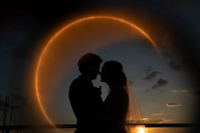 Sunset portrait of bride and groom at Epping Forest Yacht Club