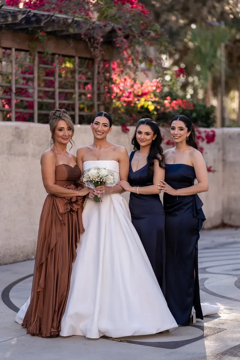 Bride with family portrait in Flagler College courtyard with bougainvillea