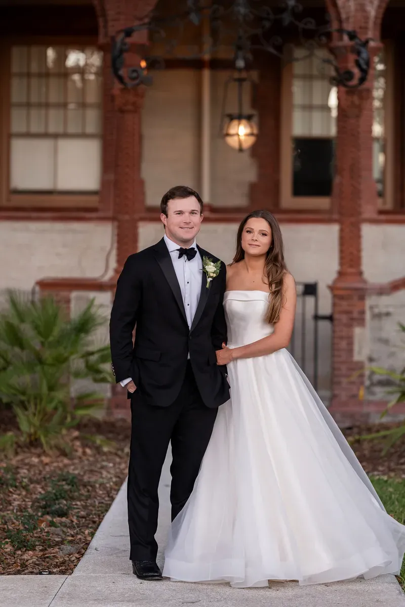 Couple portrait in front of Spanish Renaissance architecture at Flagler College
