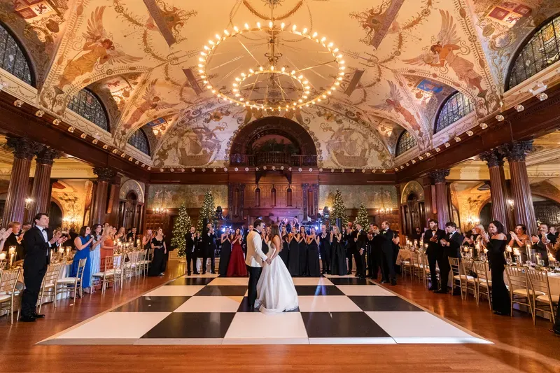 First dance on black and white checkered floor at Flagler College winter wedding