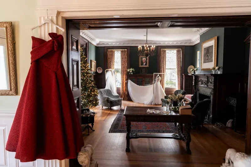 Winter wedding bridal suite at Flagler College with Christmas tree and wedding dress