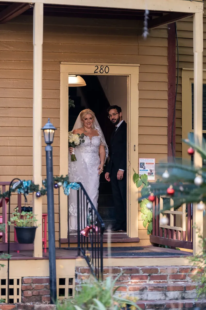 Bride exiting the historic St Francis Inn building