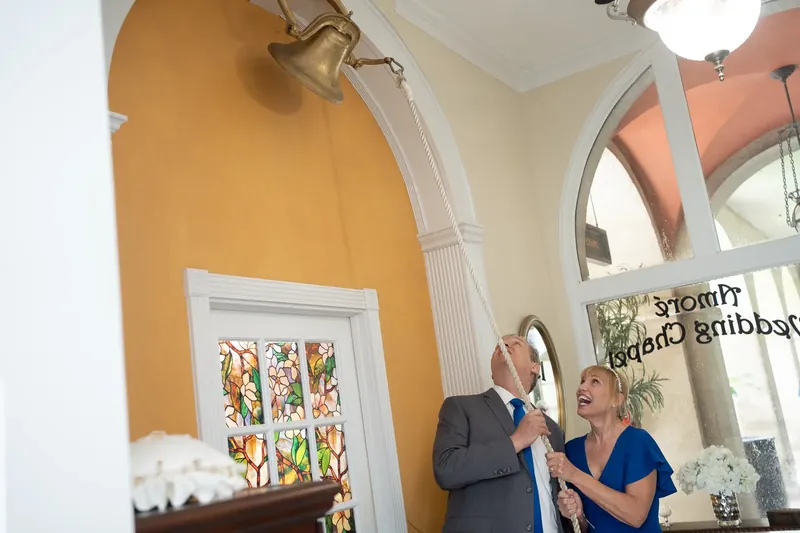 Newlyweds ringing the wedding bell at Amore Chapel St Augustine