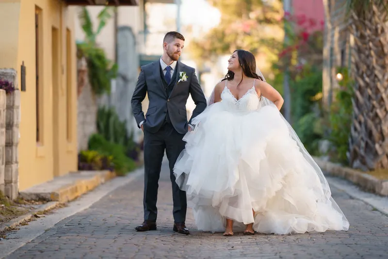Bride and groom on cobblestone street in historic St Augustine