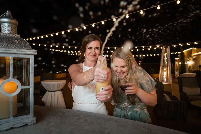 Fun bride shooting beer at camera during St Augustine wedding