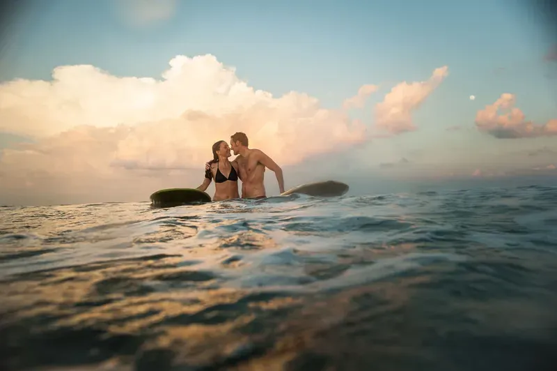 Surfing engagement session at sunset in Jacksonville