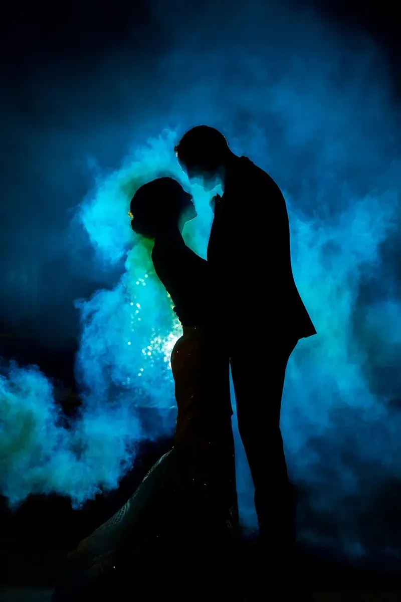 Couple dancing in blue fog at the Lightner Museum