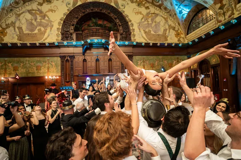 Bride crowdsurfing at Flagler College reception