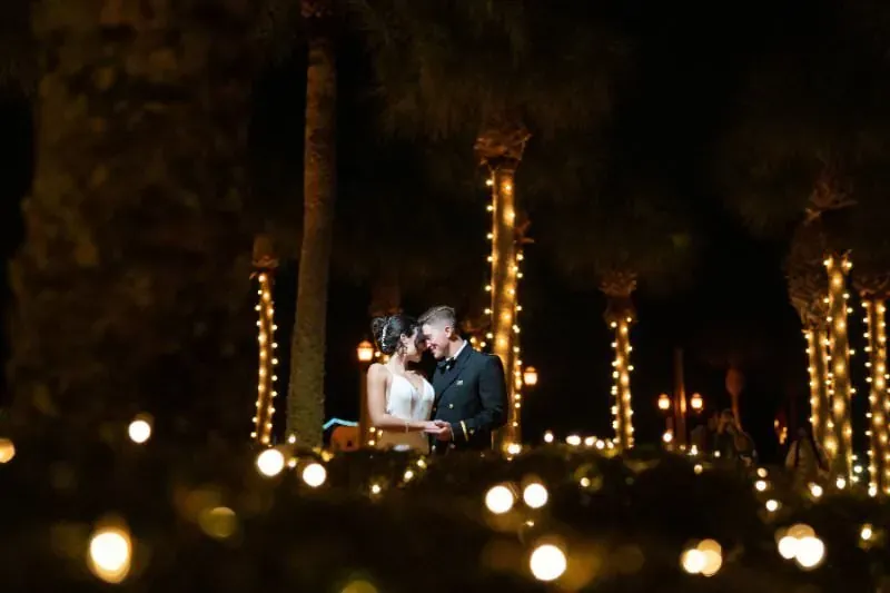 Wedding couple under string lights at night The White Room St Augustine