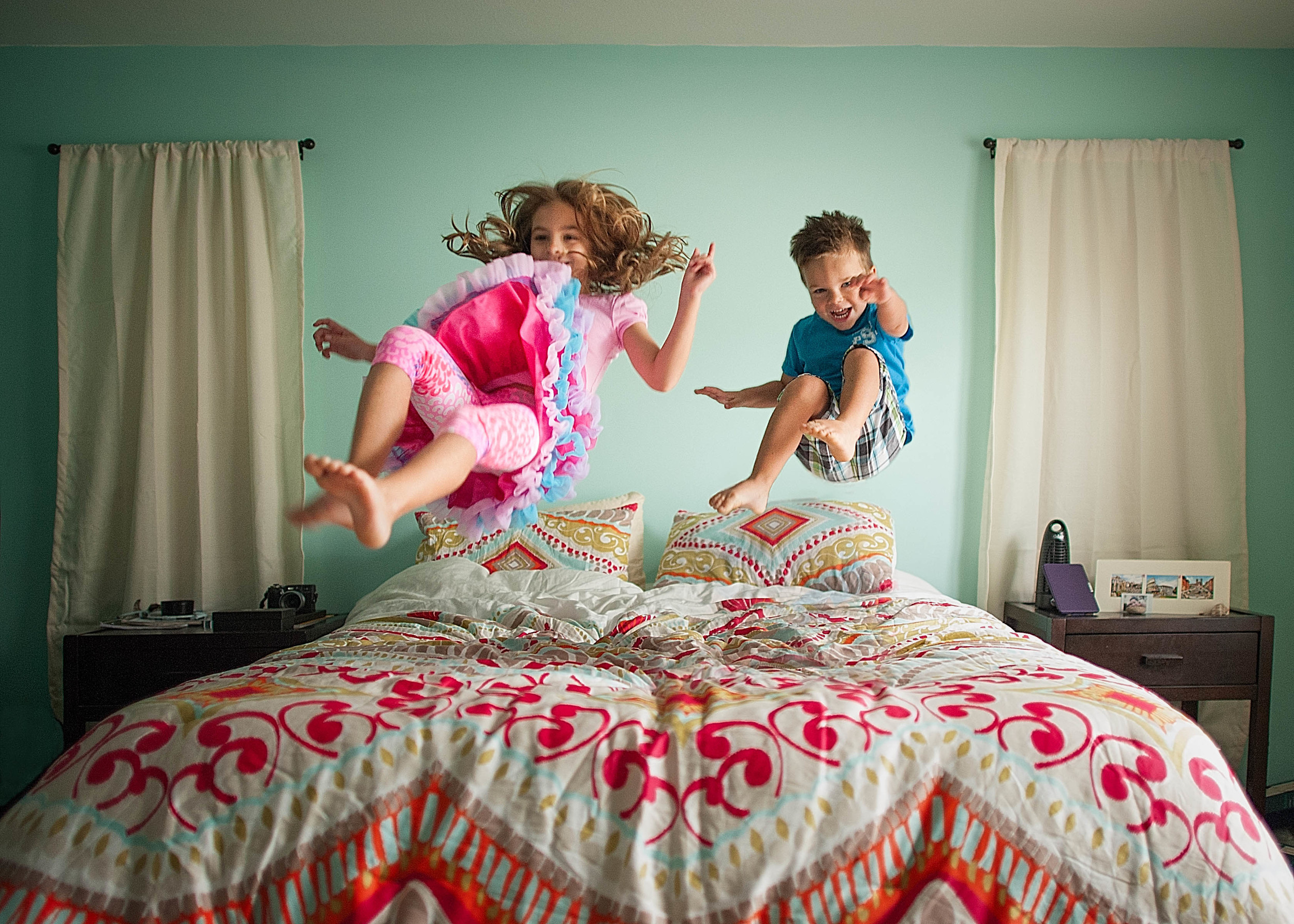 My kiddos, jumping on the bed.