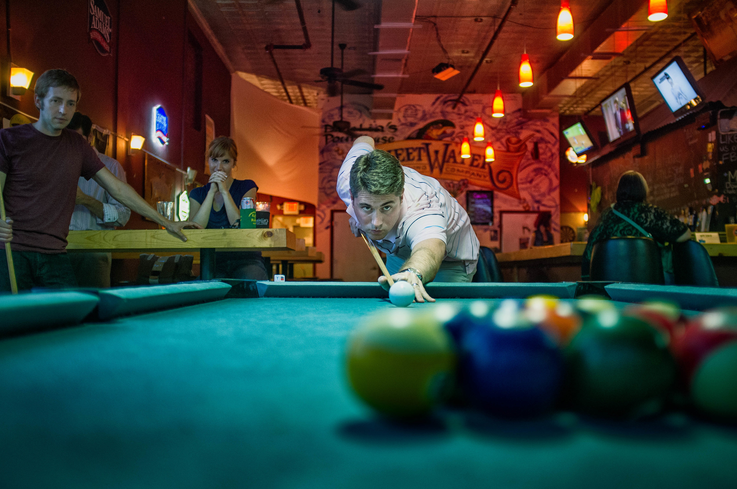 Kip, focused on playing pool.