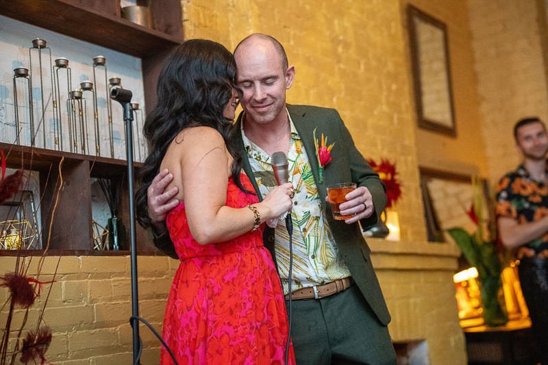 0027_Warm embrace and shared smiles at a vibrant indoor gathering.jpg