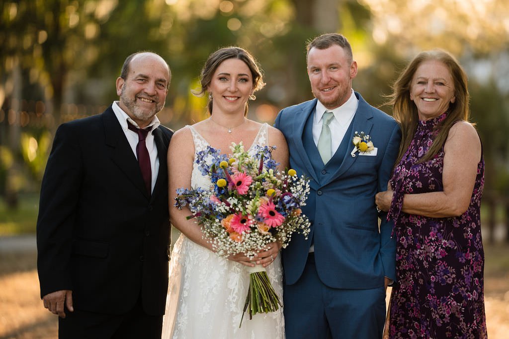 A happy family celebrates a wedding with smiles and love.jpg