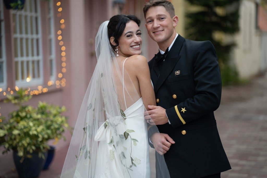 A newlywed couple shares a joyful moment on their wedding day.jpg