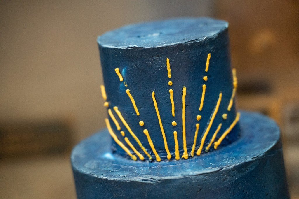 Blue cake with yellow design.jpg