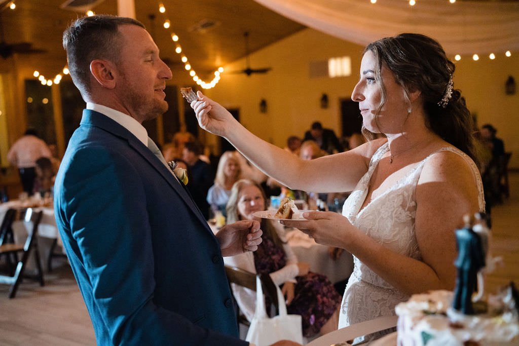 Bride feeding groom wedding cake a sweet moment captured.jpg