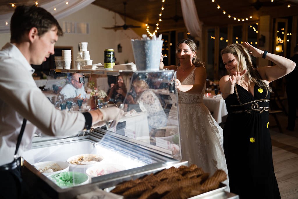 Ice cream bar at a wedding reception The bride and her guest are getting ready to enjoy some sweet treats.jpg