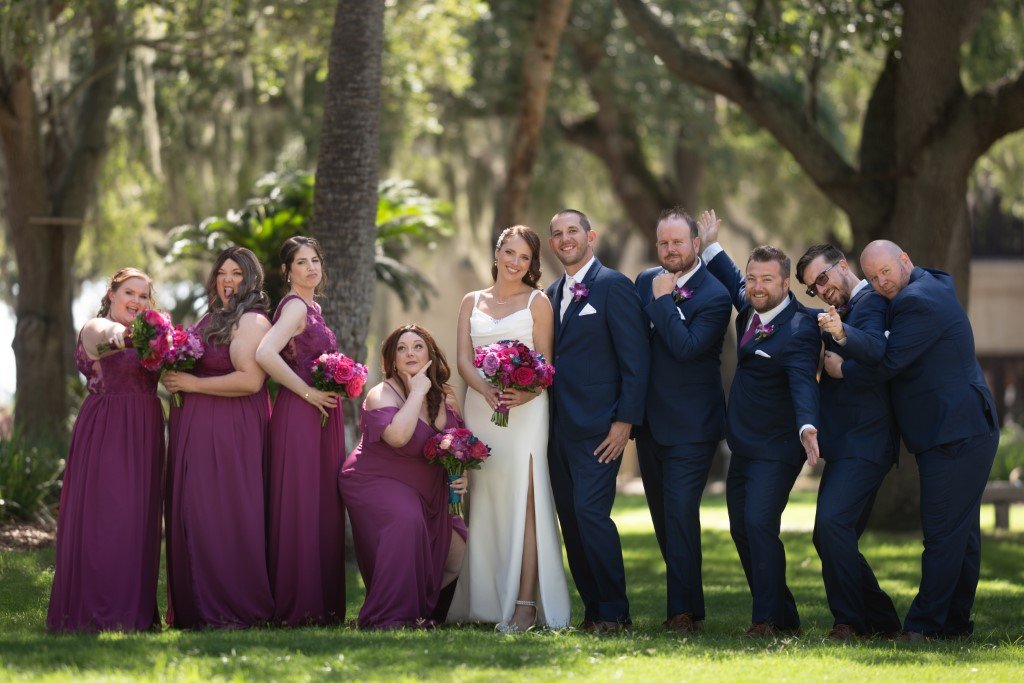 Joyful wedding party poses outdoors.jpg