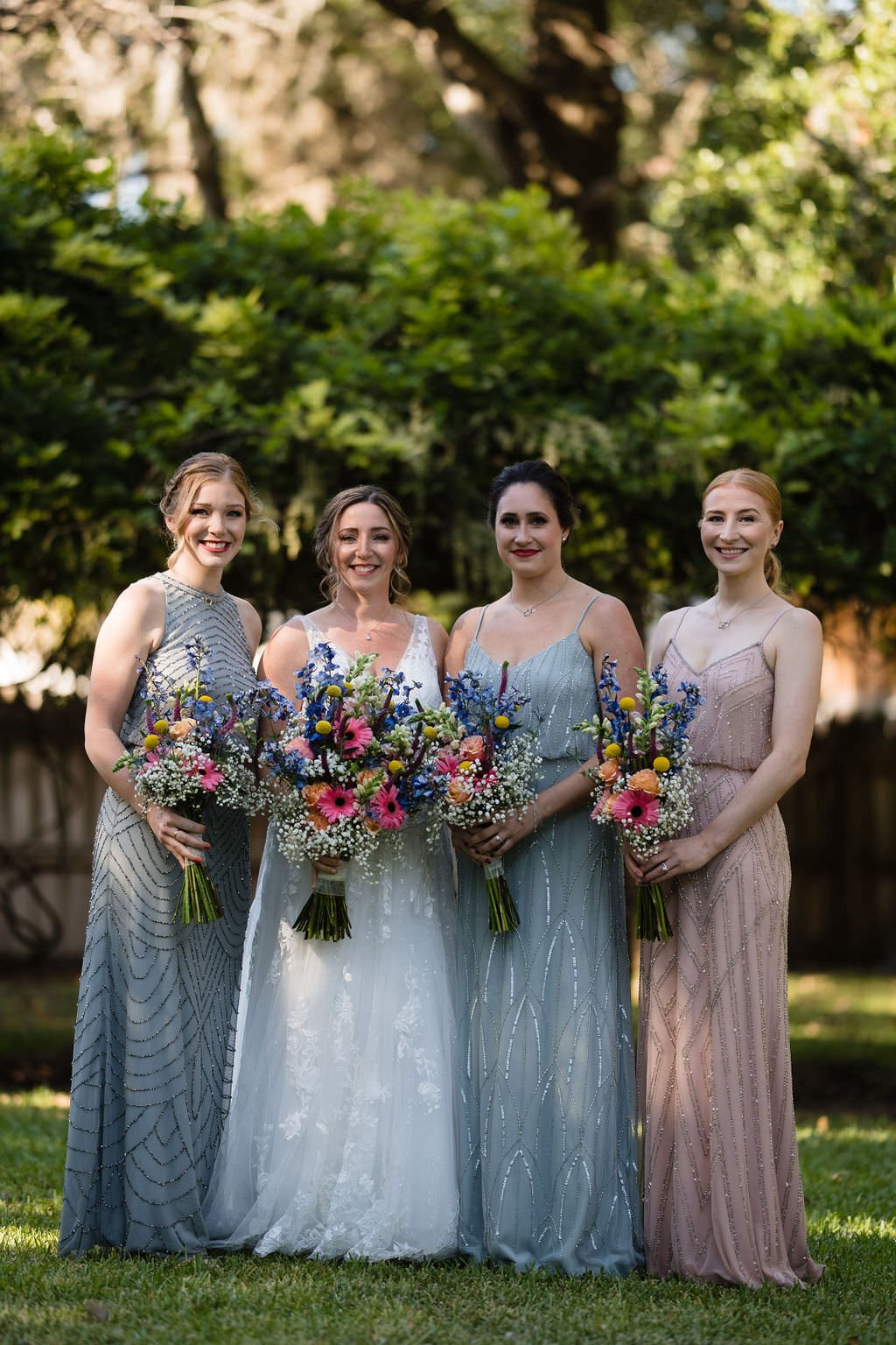 The bride and her bridesmaids are looking radiant in their elegant gowns.jpg