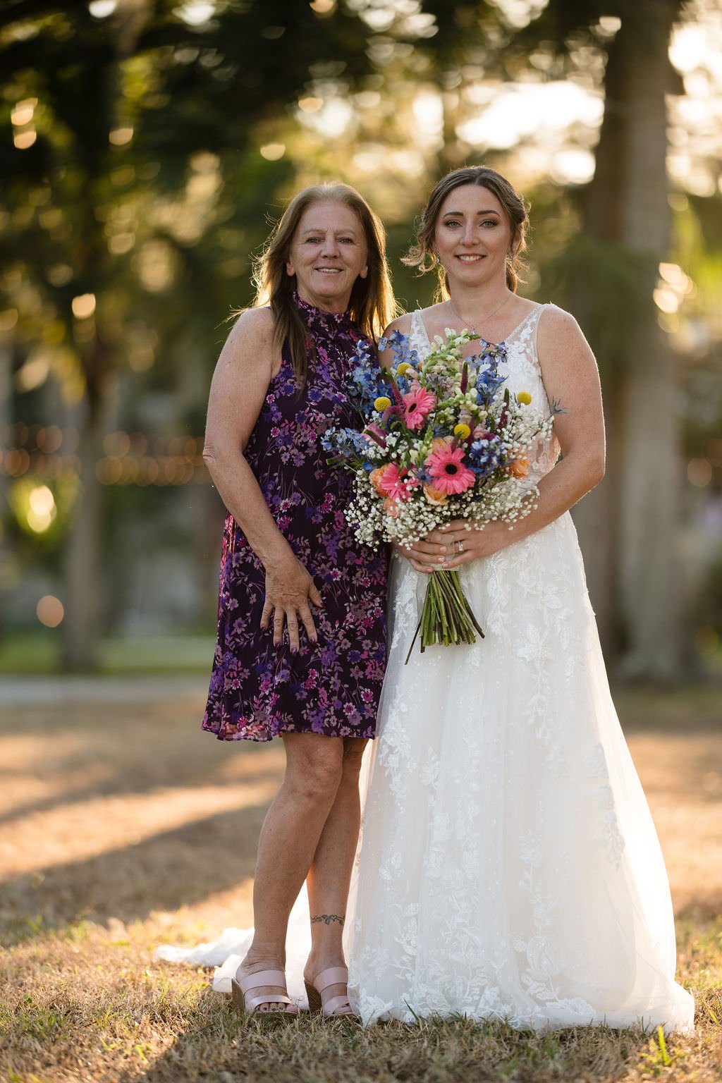 The bride and her mother beaming with joy on her wedding day.jpg