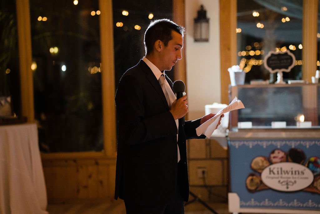 The groom delivers a heartfelt speech at his wedding reception.jpg